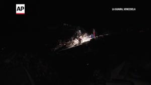 Woman's entire family is under a pile of rubble when the buildings in Caraballeda, where her family lived, collapsed.