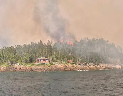 Crews working to contain wildfire that has damaged cabins in Newfoundland
