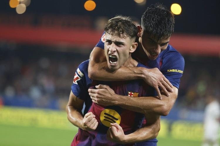 Barcelona routs Valencia 6-0 with goals from Raphinha, Lewandowski and López