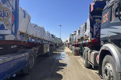 Live updates: A UN official says 20 aid trucks with food are waiting to enter Gaza