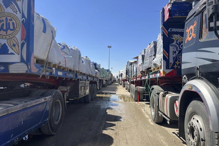 Live updates: A UN official says 20 aid trucks with food are waiting to enter Gaza