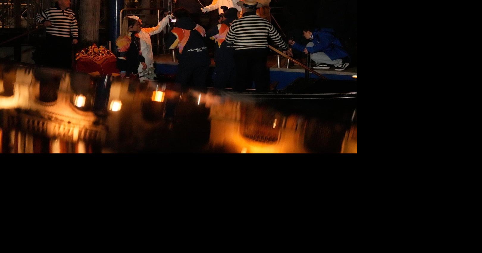 Olympic flame makes historic passage down Venice’s Grand Canal