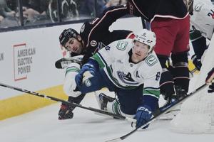 Jenner scores twice, Blue Jackets rally for 7-6 victory over Canucks in shootout