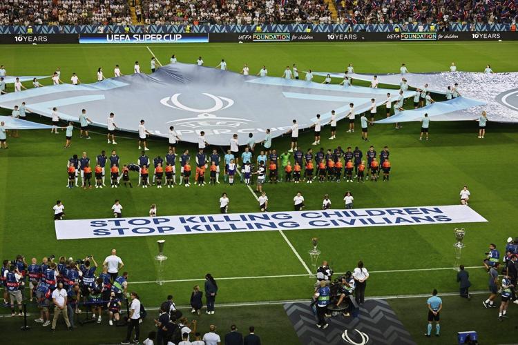 UEFA rolls out banner in support of children in war zones ahead of Super Cup