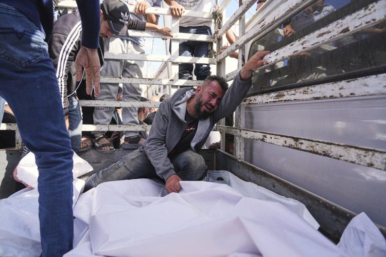 At least 23 people killed by Israeli strikes in Gaza as Israel lets minimal aid in