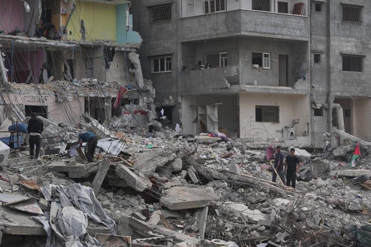 The Latest: Palestinians journey back home as aid convoys enter Gaza ...
