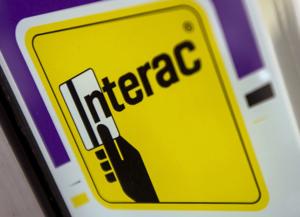 Interac users report debit payment issues, service provider acknowledges problems but says system 'operated normally'