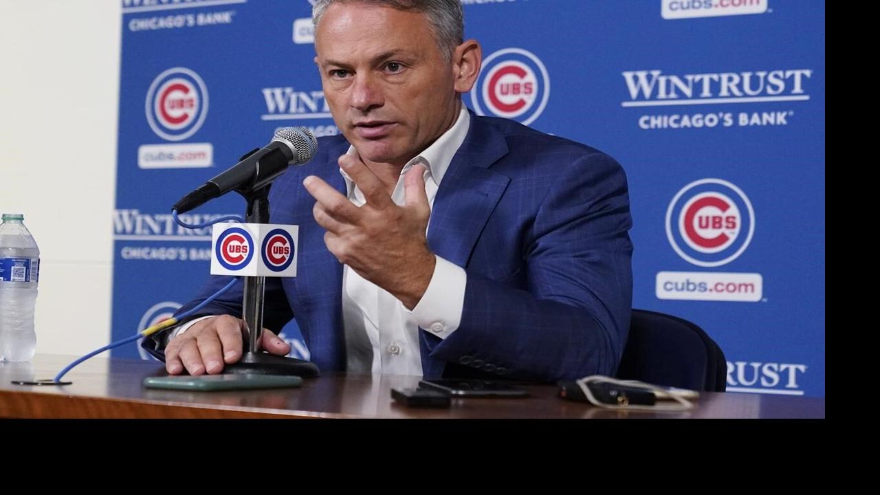 President Jed Hoyer of the Chicago Cubs presents a jersey to