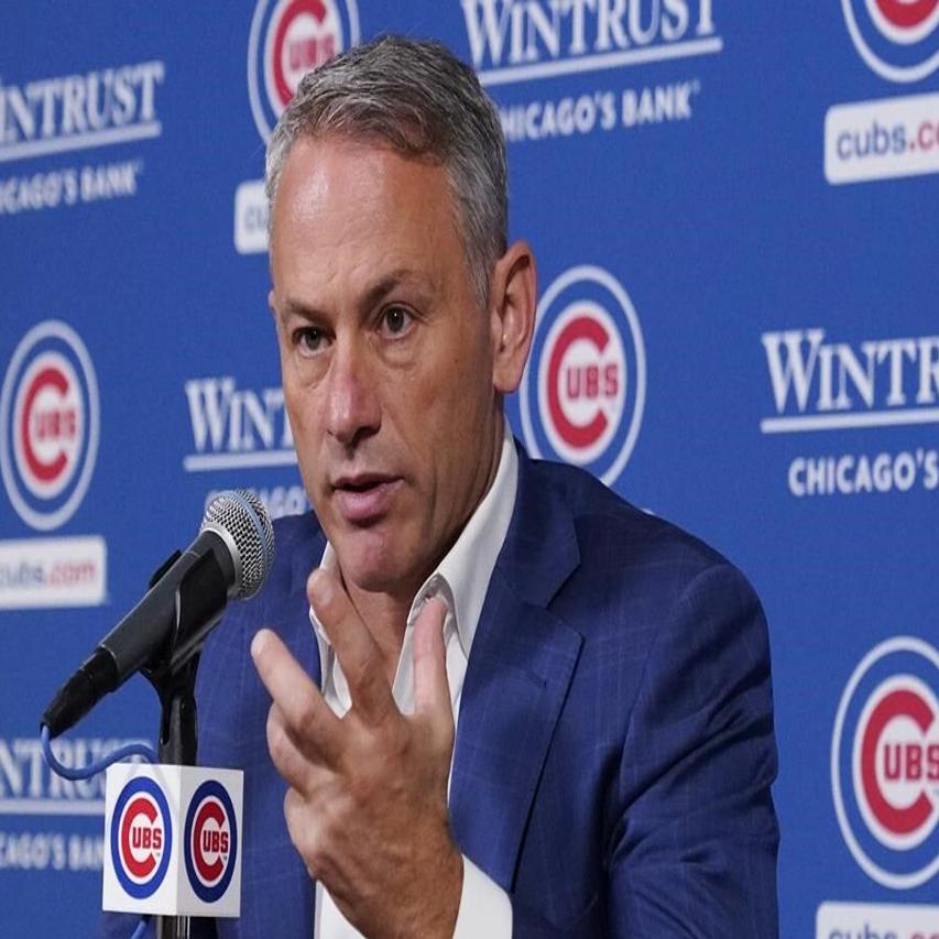 President Jed Hoyer of the Chicago Cubs presents a jersey to