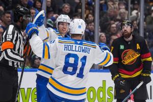 Blues keep playoff hopes alive by beating struggling Canucks 3-1