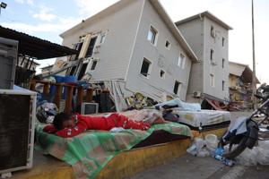 A strong aftershock rattles Venezuela as rescue workers race to find survivors