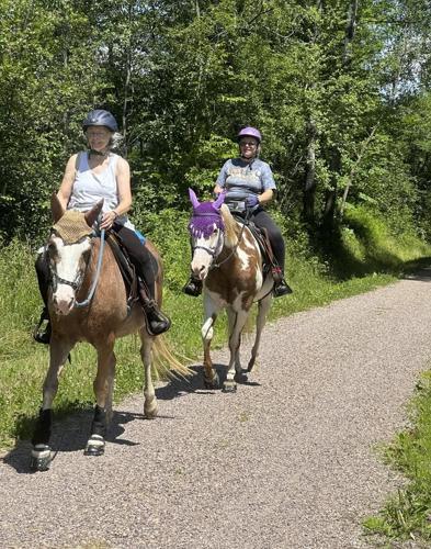 Hikers and cyclists can now cross Vermont on New England's longest rail trail, a year after floods