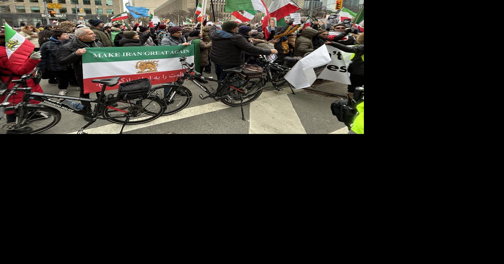 Employees at the U.S. consulate on University Avenue watched on from the rooftop as protesters made their way to the building’s front steps.

