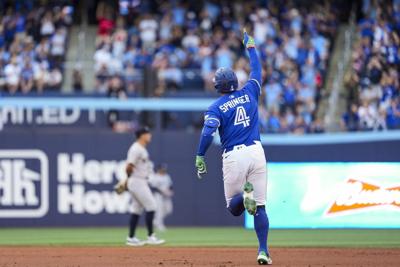 Springer homers twice, Blue Jays win 8-5 to sweep Yankees and take first in AL East