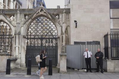 Banksy unveils a new mural of a judge beating a protester outside London court
