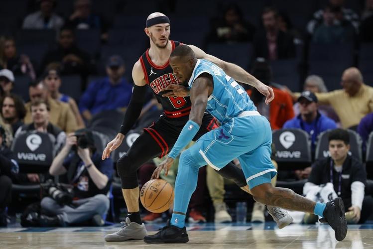 Coby White scores 27 as Bulls hold on to beat Hornets 119-112 in OT