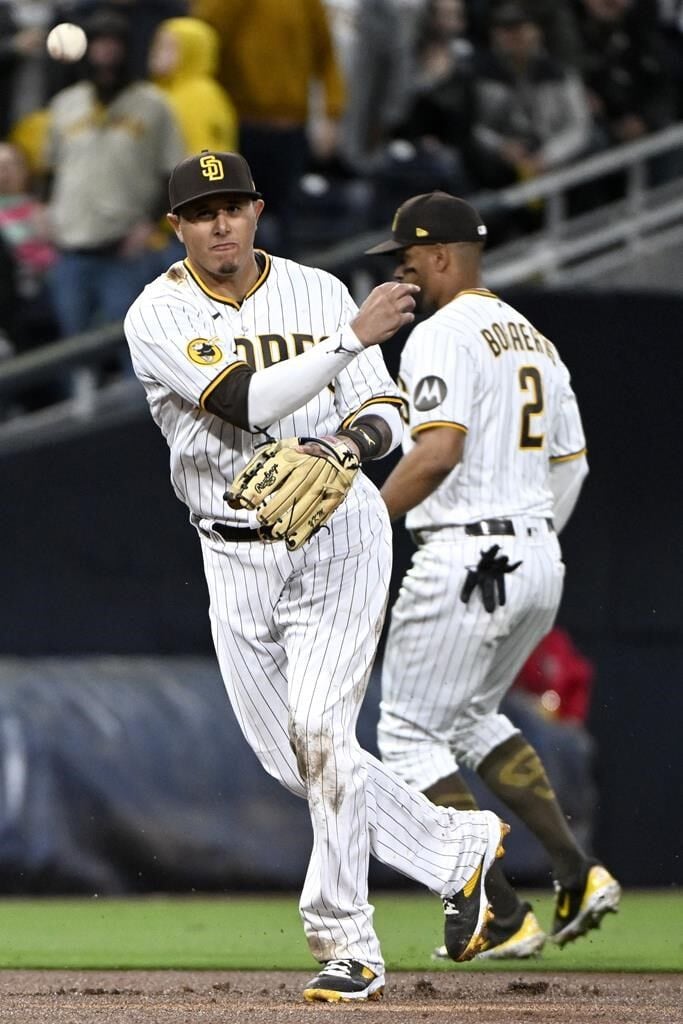 Cron, Rockies rain homers on Padres for 7-2 opening win