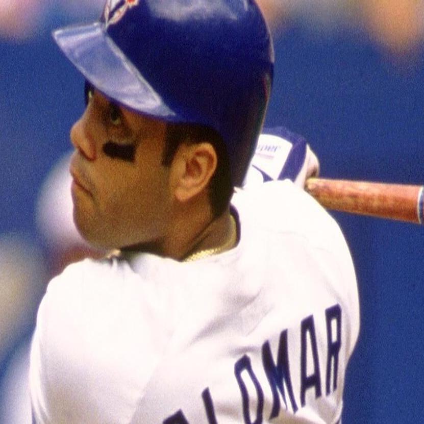 Why was Roberto Alomar banned from the MLB?