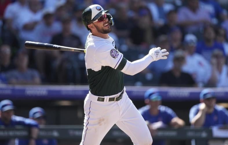 Kris Bryant hits one of the Rockies' four homers in a 7-3 win over the