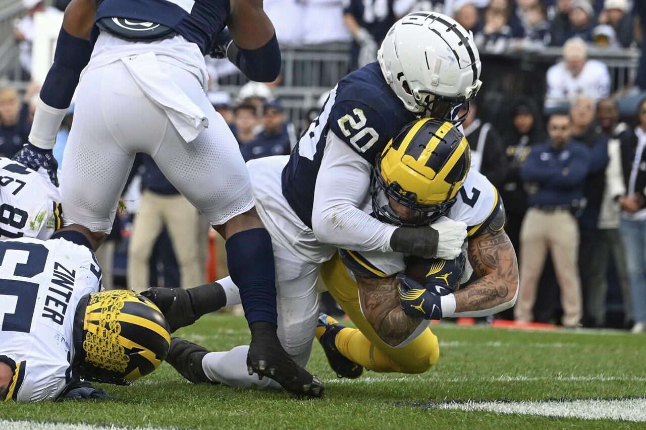 Without Jim Harbaugh No. 2 Michigan grinds past No. 9 Penn State