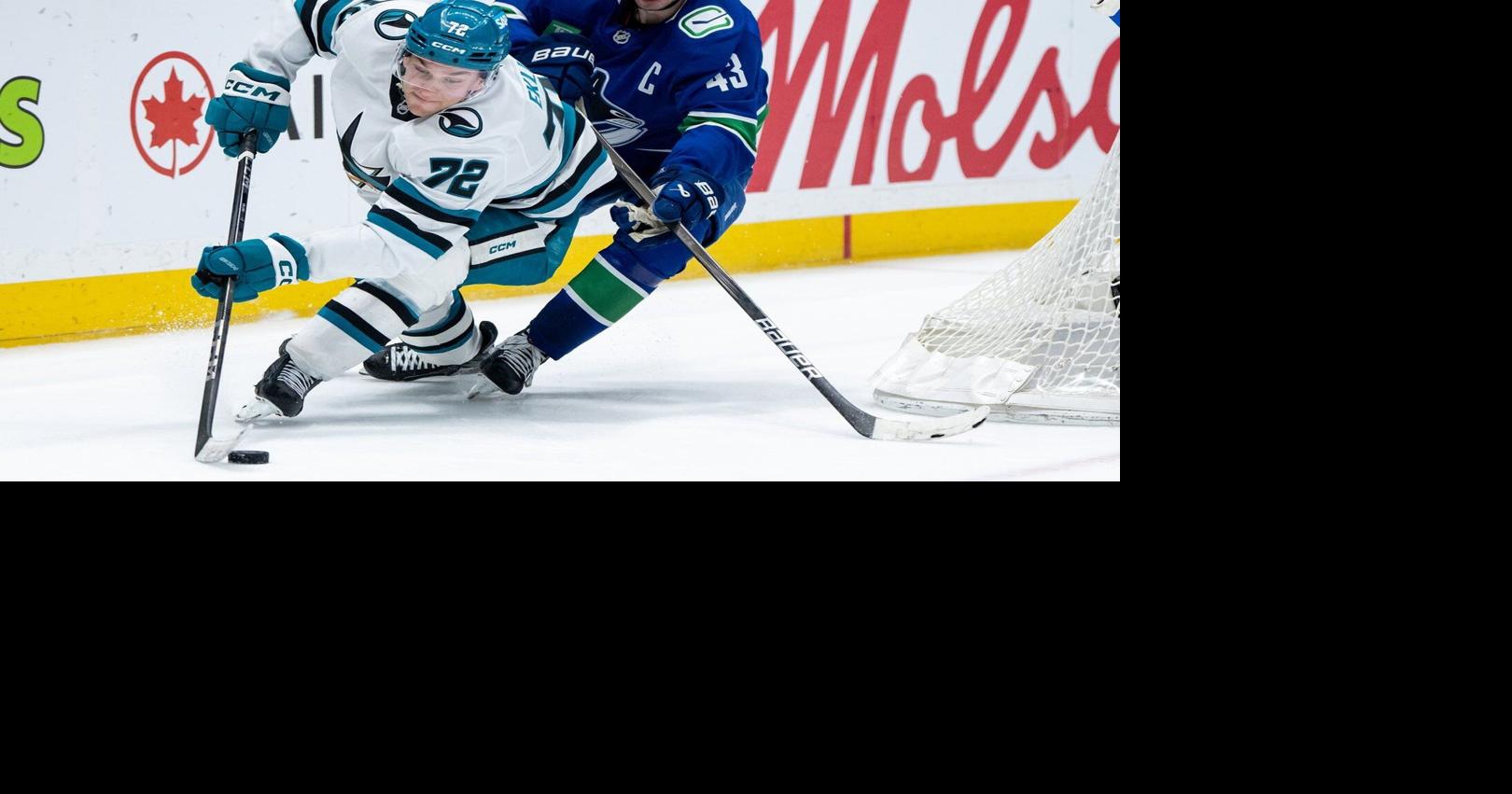 DeBrusk scores in OT, Vancouver Canucks edge slumping San Jose Sharks 2-1