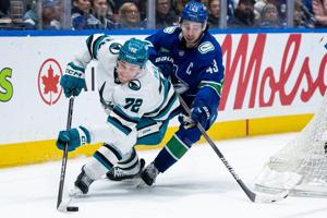 DeBrusk scores in OT, Vancouver Canucks edge slumping San Jose Sharks 2-1