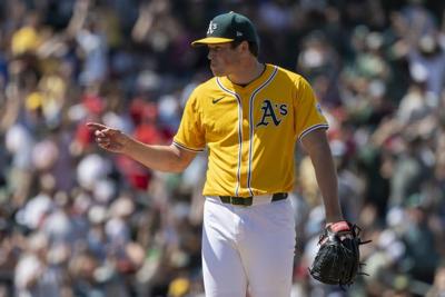 A's catcher MacIver gets go-ahead hit, throws out runner to end game in big league debut at age 28