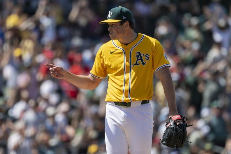 A's catcher MacIver gets go-ahead hit, throws out runner to end game in big league debut at age 28