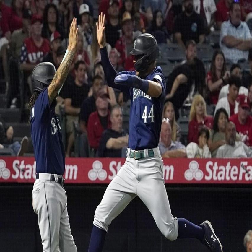 PHOTOS: Seattle Mariners Catcher Cal Raleigh Raises The 12 Flag