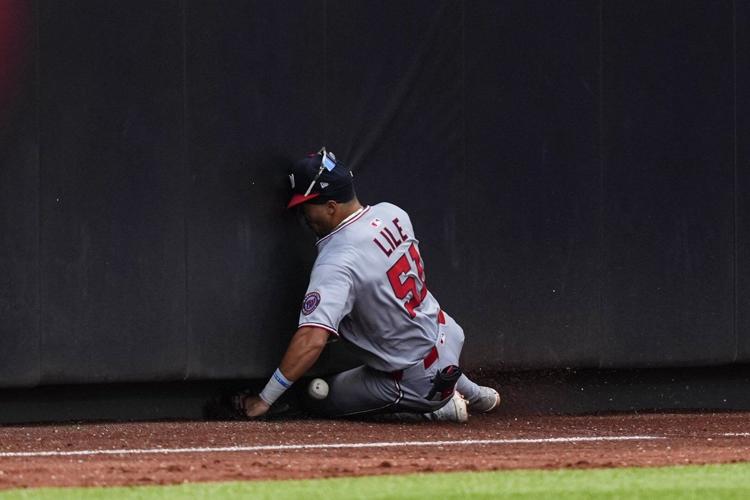 Nationals rookie Daylen Lile exits with knee injury after sliding into ...