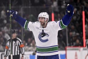 Garland scores his 2nd goal of the game in OT to lift the Canucks past the Kings, 3-2