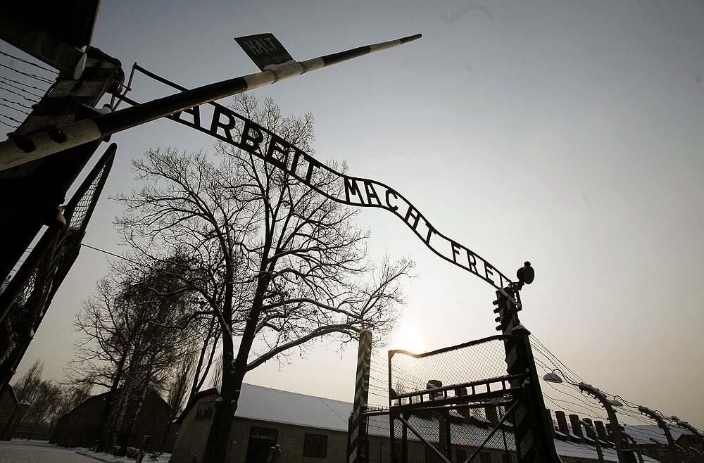 Ex neo-Nazi leader sought in Auschwitz sign theft