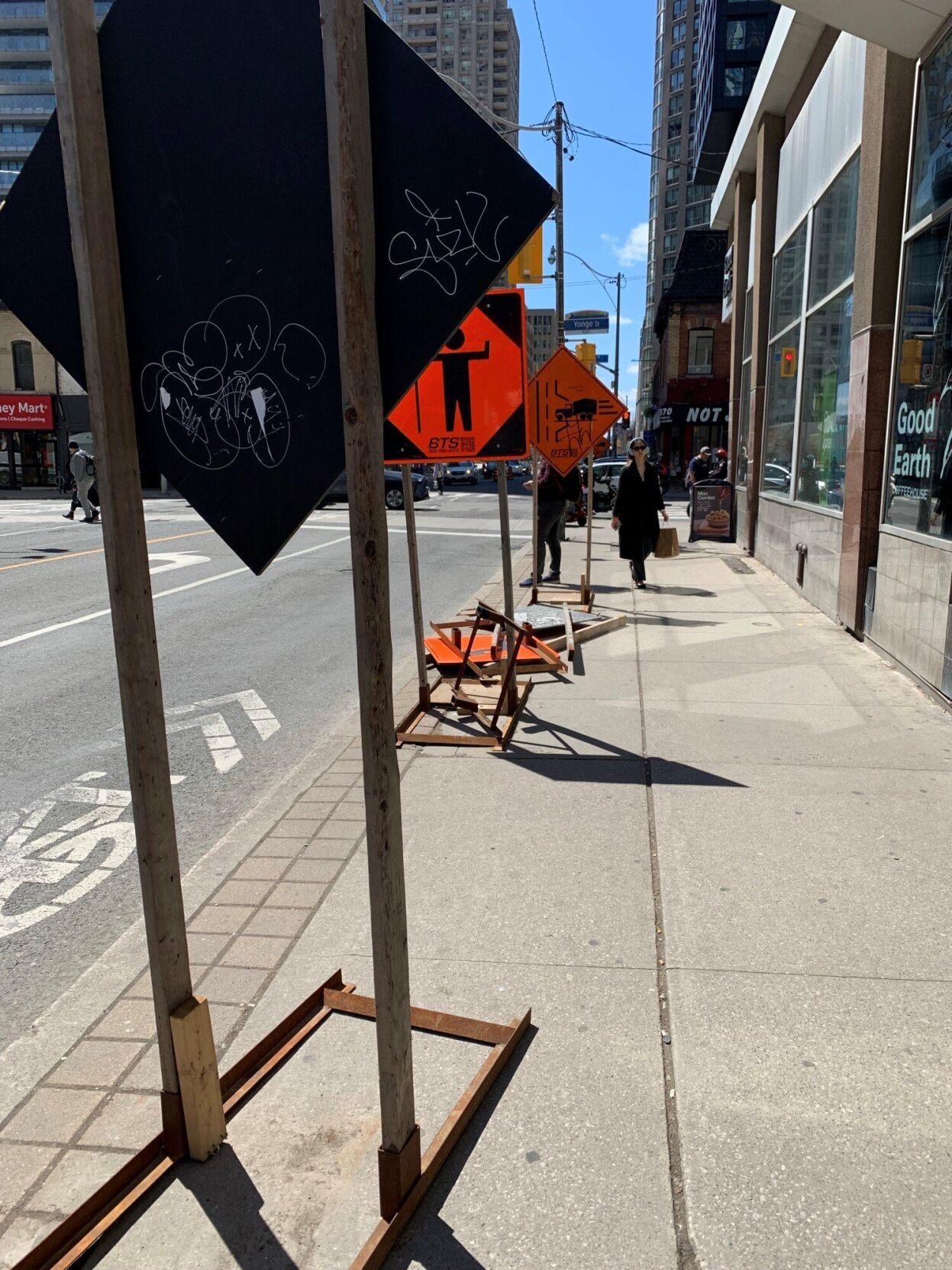 construction signs on the sidewalk