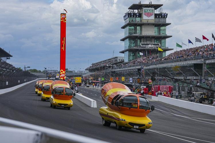 Hot diggity dog! Wienermobiles put on riveting race in Wienie 500 at Indianapolis Motor Speedway