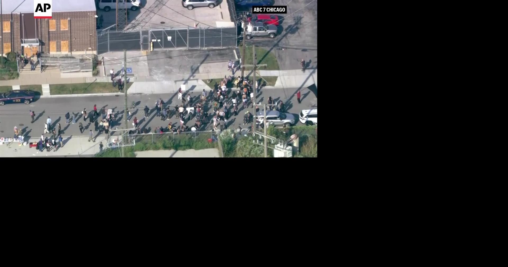 Protesters arrested as demonstrators block vehicles at key immigration ...