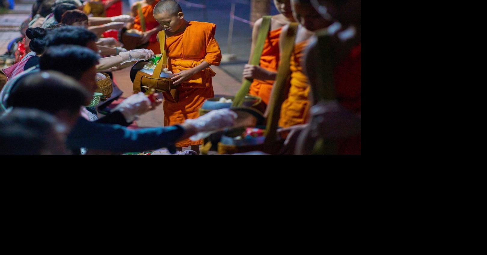 Photos of Buddhist monks in Laos praying in region littered with unexploded bombs