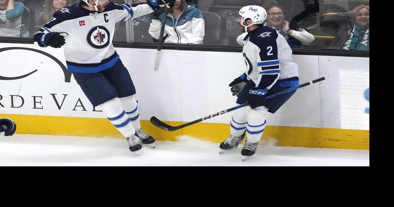 Lowry scores late goal to help Jets sink Sharks 4-3