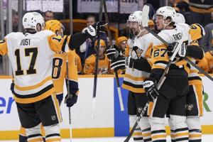 Rust scores in overtime, Crosby has 4 points in Penguins' 5-4 win over Predators
