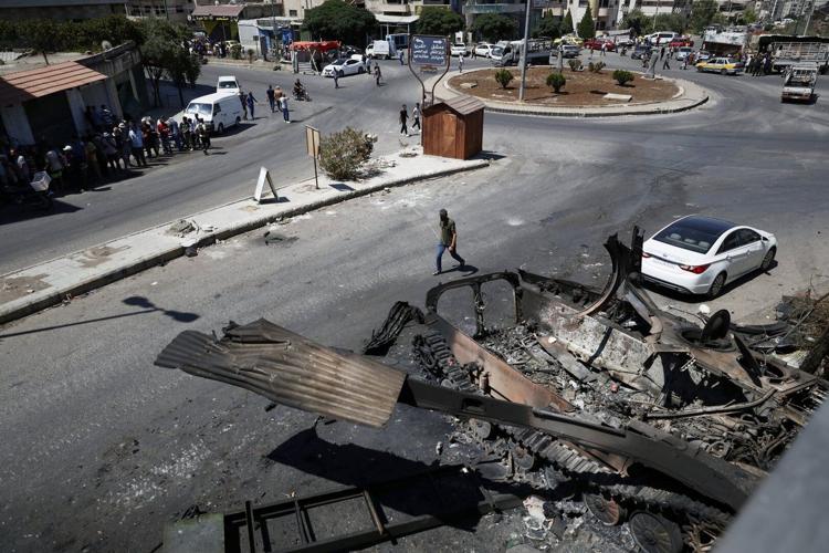In Syria’s Sweida, the stench of death still lingers days after sectarian bloodshed
