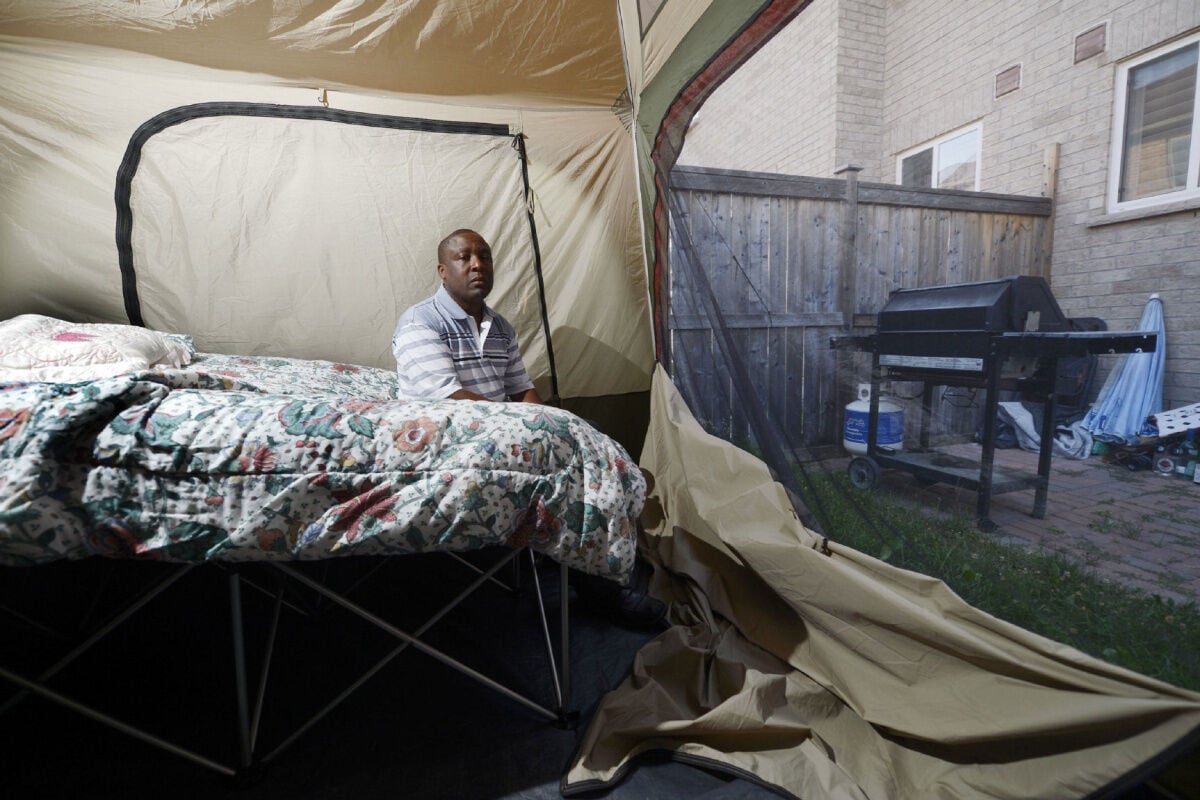 Homeowners swelter in backyard tent amid heated insulation dispute