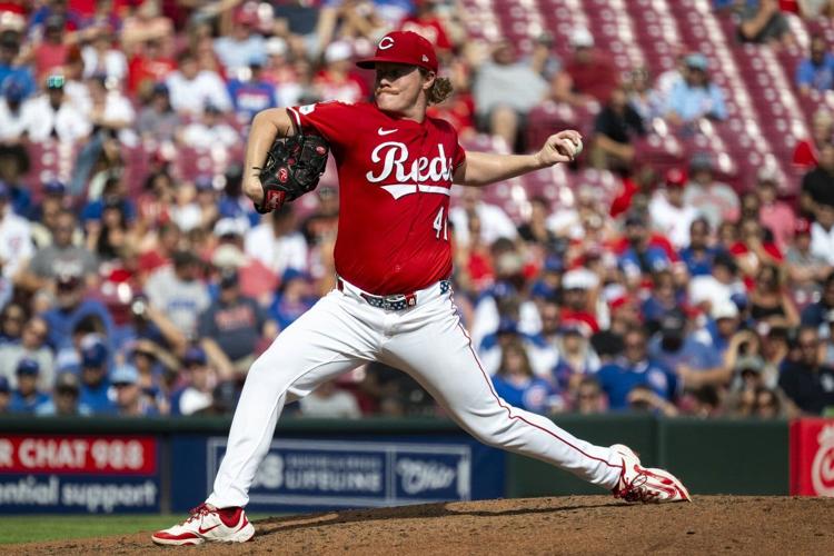 Surging Reds blank Cubs, move into tie for NL wild card spot