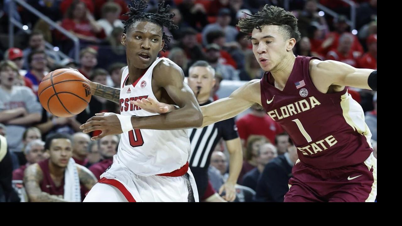 March 9, 2023: North Carolina State Wolfpack guard Jack Clark (5) knocks  the ball away from