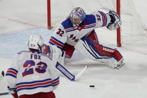 NHL-leading Rangers get 50th win, Quick sets US record in 8-5 victory over Coyotes