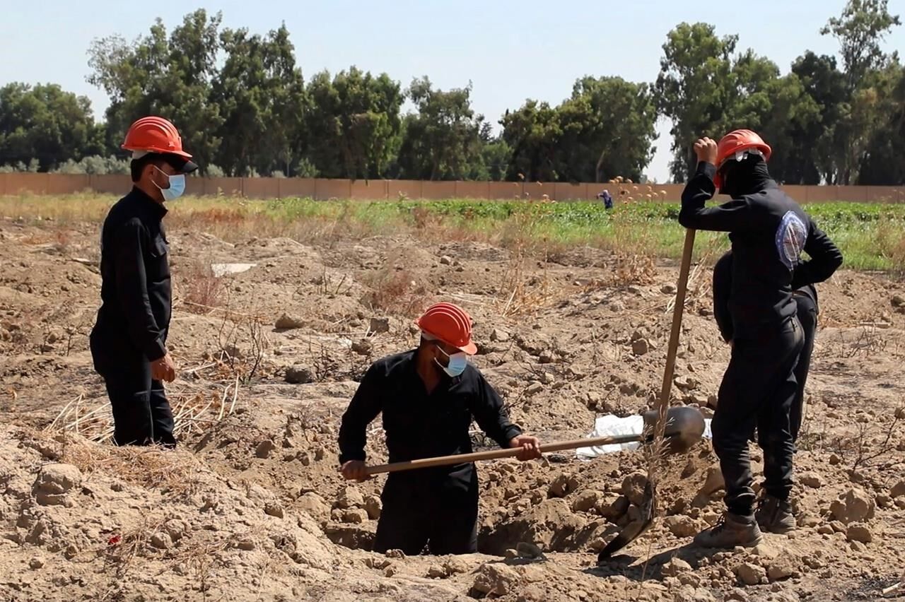 Workers Recover Hundreds Of Bodies From Syrian Mass Grave