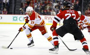 Huberdeau's late goal caps Flames' third-period outburst in 5-3 comeback win over Devils