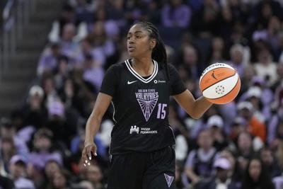Valkyries guard Tiffany Hayes helped off court after being hit in the head