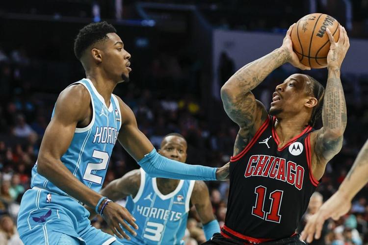 Coby White scores 27 as Bulls hold on to beat Hornets 119-112 in OT