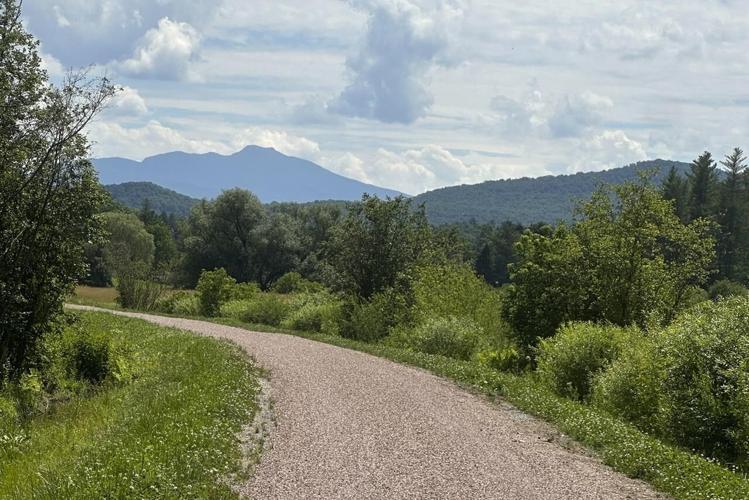 Hikers and cyclists can now cross Vermont on New England's longest rail trail, a year after floods