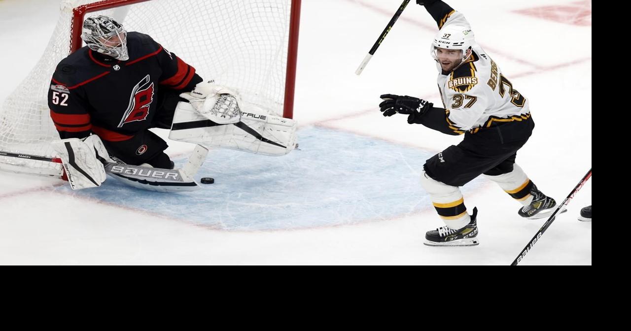 Bruins beat Canes for NHL home record to start the season