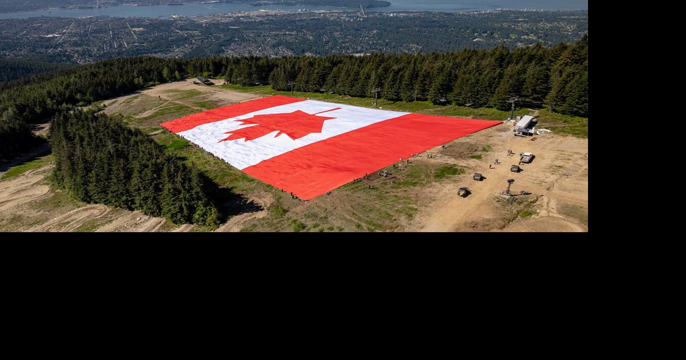 Giant Canadian flag unfurled on Grouse Mountain